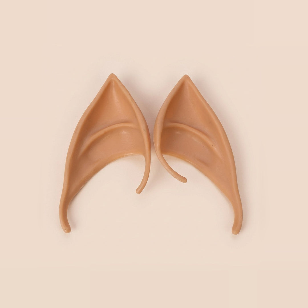 Warm tan latex elf costume ears with curved hooks lying side by side on a cream background, 3.94 in (10 cm) pair.