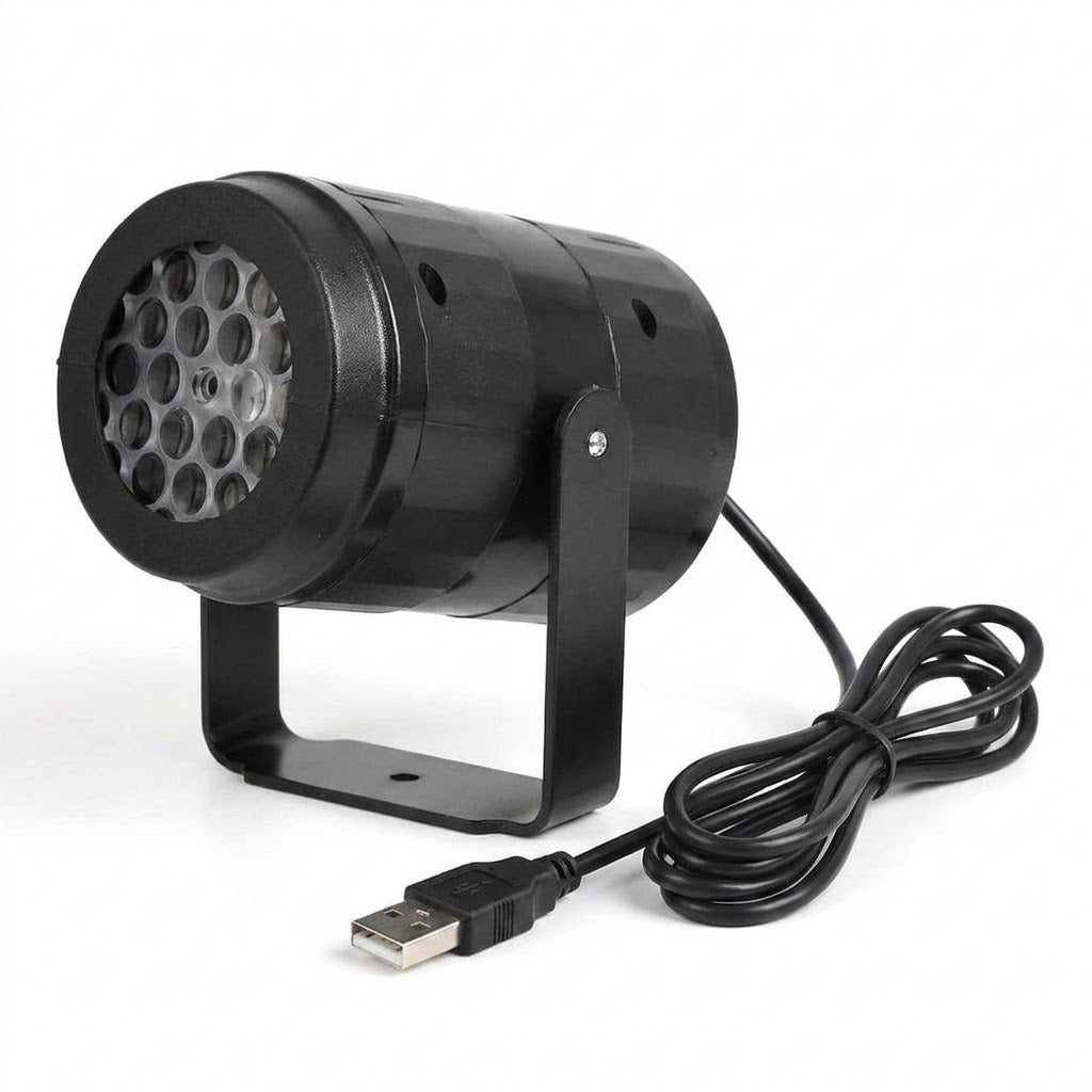 A black snowflake projector faces left on a U-shaped stand with its coiled USB cable against a white background.