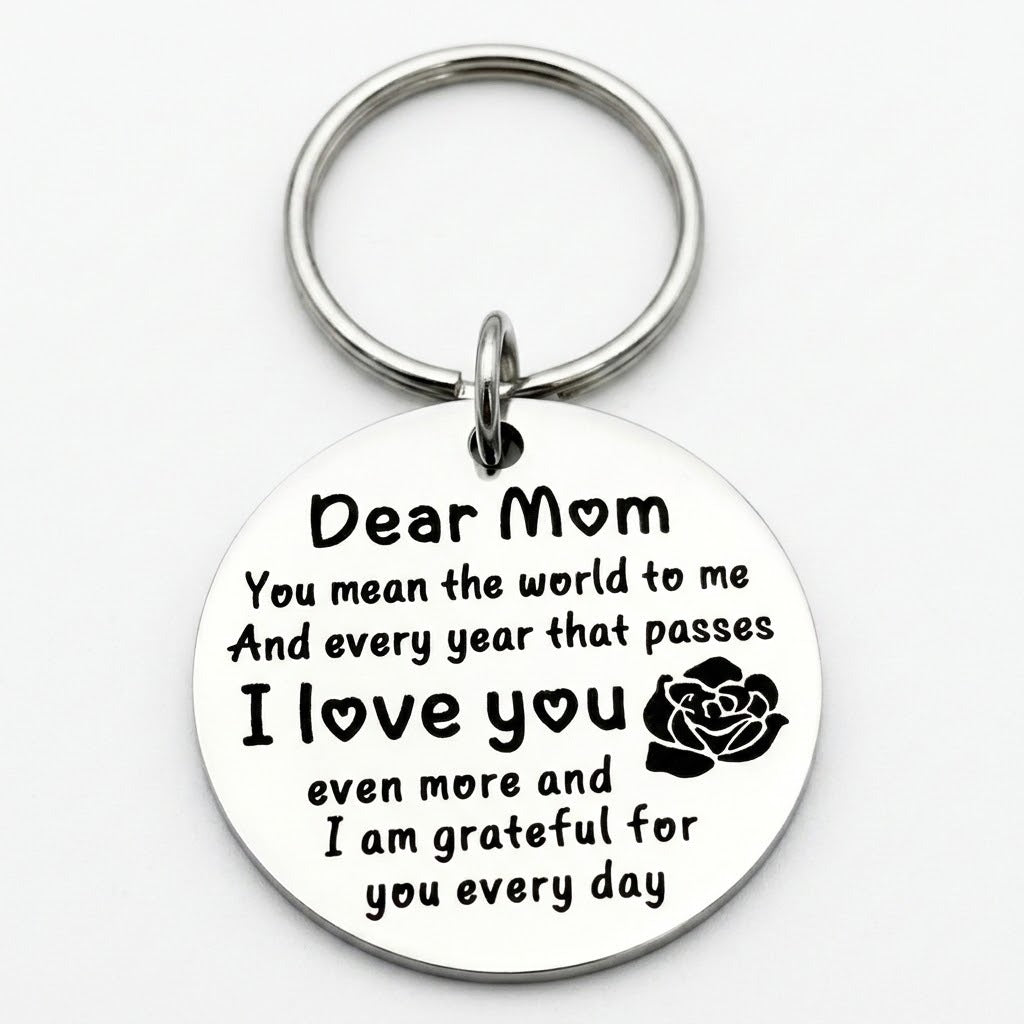 Silver circular keychain displays a black Dear Mom message and rose motif beneath a round split ring on a white background.