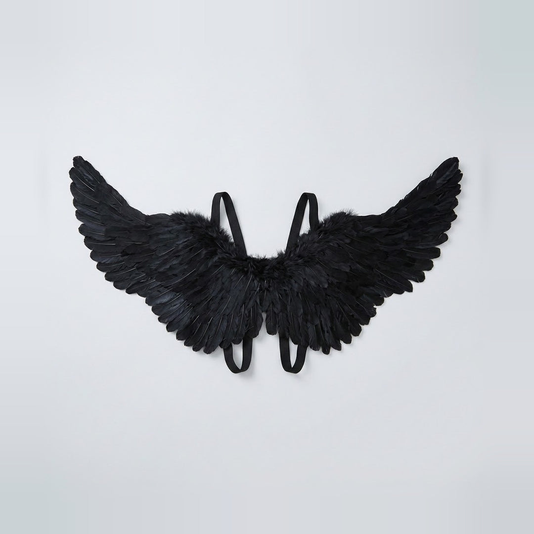 Black feather costume wings spread wide with raised tips and matching shoulder straps against a light gray background.
