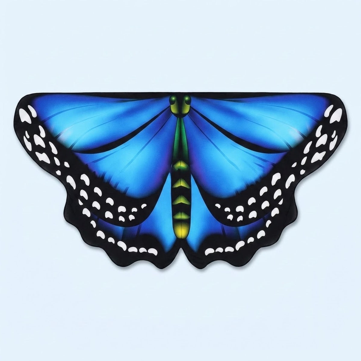 Bright blue butterfly wing cape with black spotted edges and a green body, laid flat on a pale blue background.
