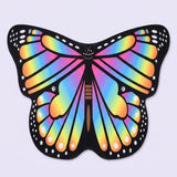 Rainbow butterfly wing cape with multicoloured veined wings, black spotted borders, and a brown body, on a pale lavender background.
