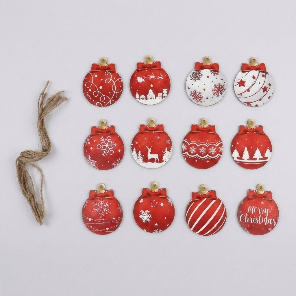 Twelve red and white wooden Christmas ornaments lie in three rows beside bundled hanging strings on a plain white background.
