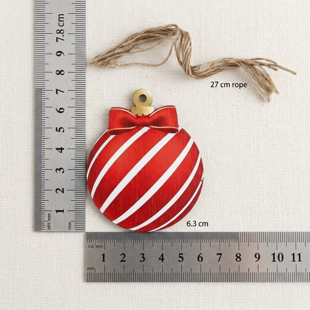 A red-and-white striped wooden Christmas ornament rests beside rulers on cream fabric, with labels showing 7.8 × 6.3 cm and 27 cm rope.