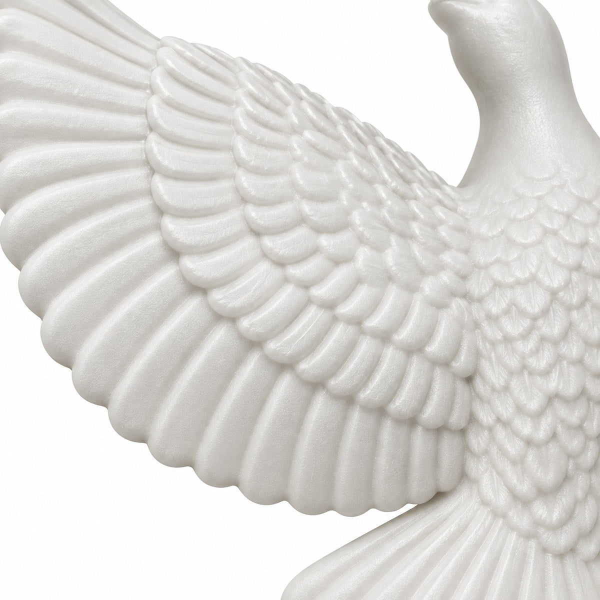 A close view shows the raised feather texture and matte finish of a white acrylic dove ornament.