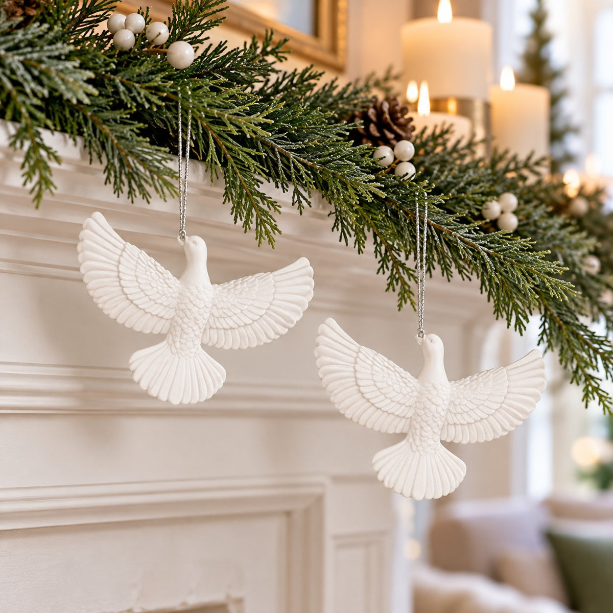White acrylic friendship dove ornaments hang from a simple holiday mantel garland in a living room.