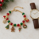 Adjustable Christmas charm bracelet beside an unmarked wristwatch to show its jewelry scale and extension chain.