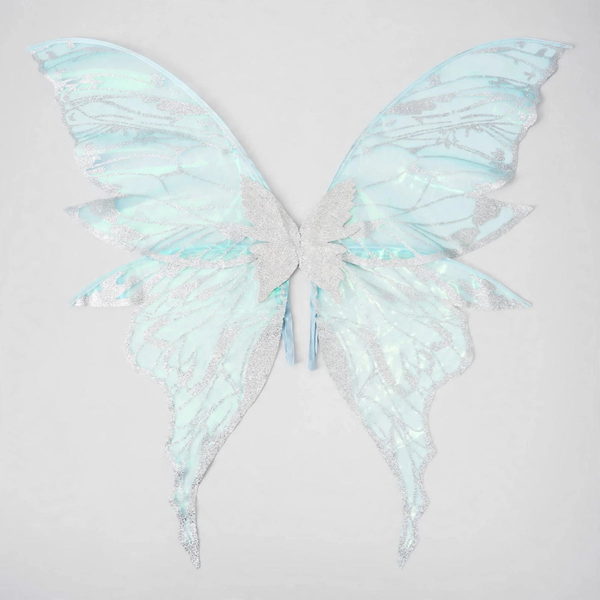 Silver fairy wings feature iridescent panels with pale blue reflections, glittery vein patterns, and long lower tips against a light gray background.