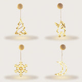Four illuminated clear ornaments shaped as a Christmas tree, Santa, snowflake, and crescent moon hang beneath round cream housings against white.