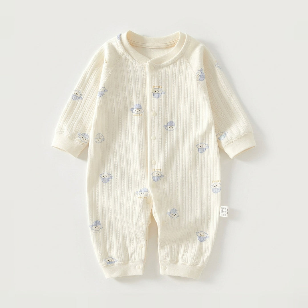 A cream-colored long-sleeve baby romper with a vertical ribbed texture and small blue cartoon bear prints, laid flat on a light gray background.