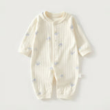 A cream-colored long-sleeve baby romper with a vertical ribbed texture and small blue cartoon bear prints, laid flat on a light gray background.