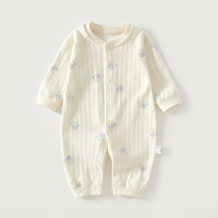 A cream-colored long-sleeve baby romper with a vertical ribbed texture and small blue cartoon bear prints, laid flat on a light gray background.