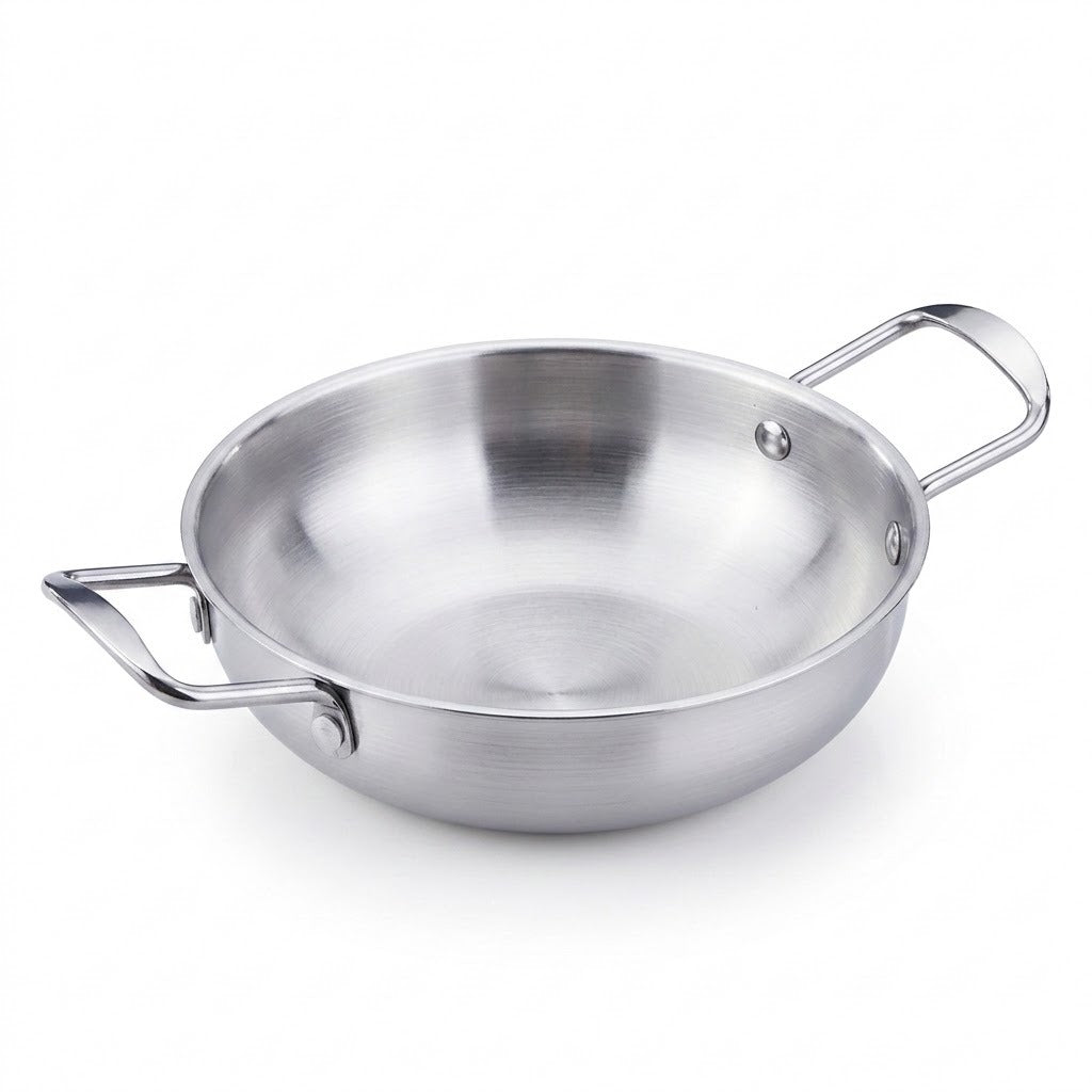 A stainless steel paella pan with two loop handles is shown against a clean white background.