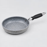 Grey speckled non-stick frying pan with a black handle shown alone against a pale studio background.