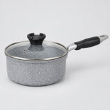 Grey speckled non-stick milk pot with glass lid and black handle shown on a pale studio background.