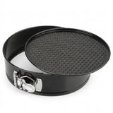 A black springform pan with a textured non-stick coated interior and a silver metal clasp, shown on a plain white background.