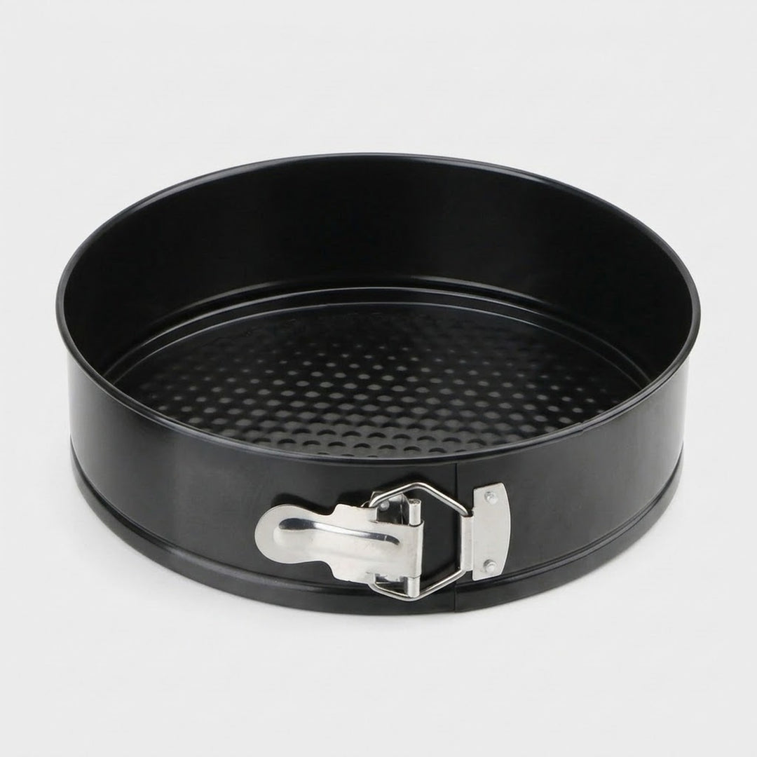 A black non-stick springform pan with a silver metal clasp, shown on a light gray background.