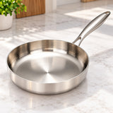 316 stainless steel frying pan shown close up to highlight its bright, smooth uncoated cooking surface.