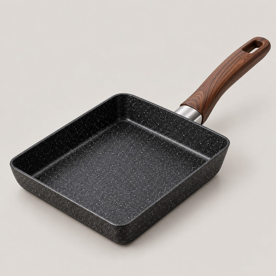 Japanese omelet pan only, with black speckled sides and a brown woodgrain-look handle.