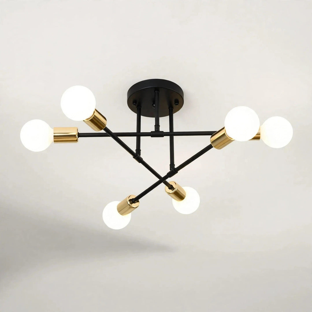 Black and gold sputnik chandelier with six glowing globe bulbs on a black iron frame against a light background.