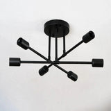Black iron sputnik chandelier with six bare sockets on branching arms against a plain light background.