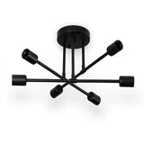 An all-black chandelier with crossing arms, six empty sockets, and a round ceiling canopy appears against a white background.