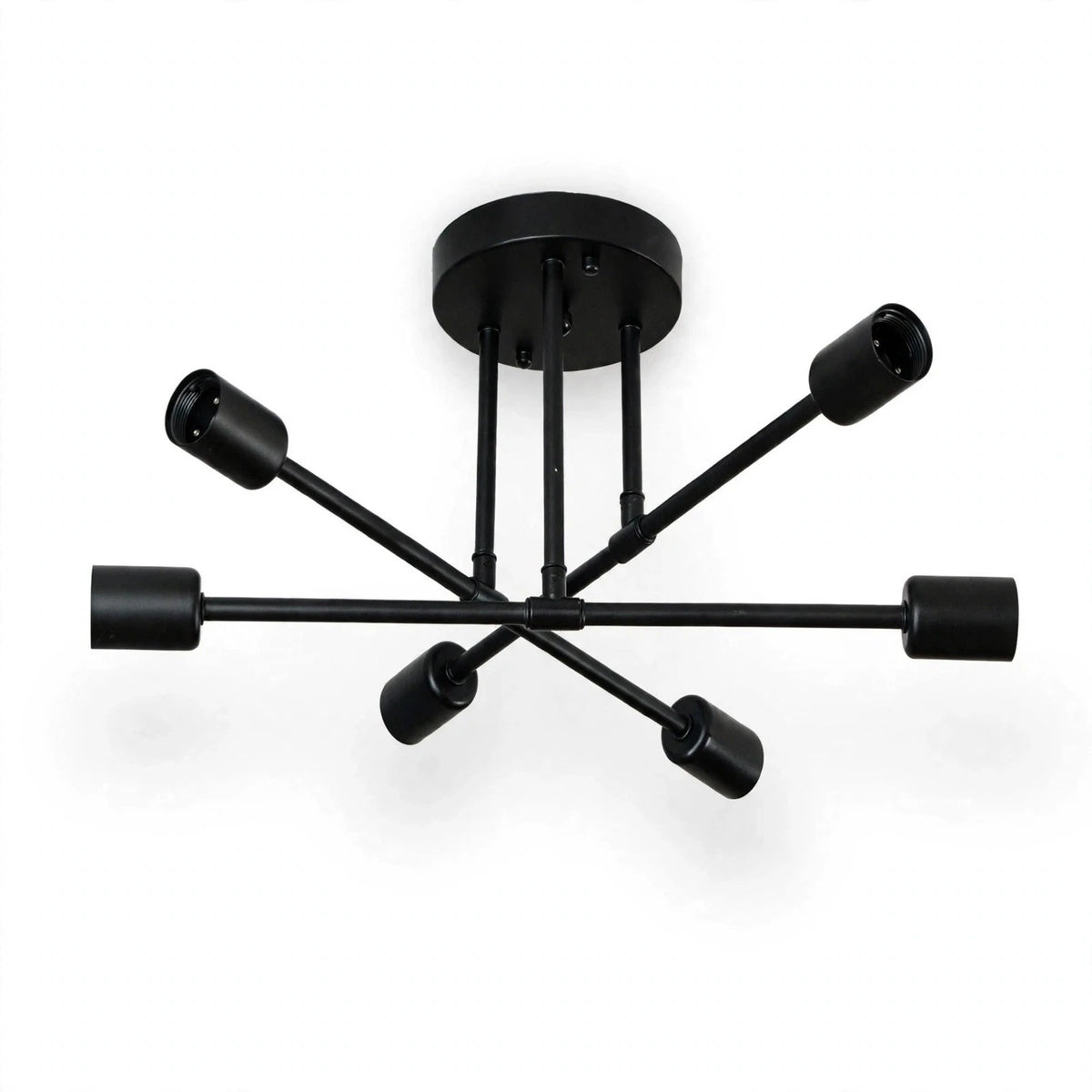 An all-black chandelier with crossing arms, six empty sockets, and a round ceiling canopy appears against a white background.