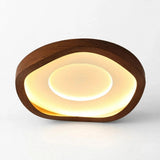 Ceiling light with a rounded triangular brown wood-grain frame and warm glowing circular center, shown against a white background.