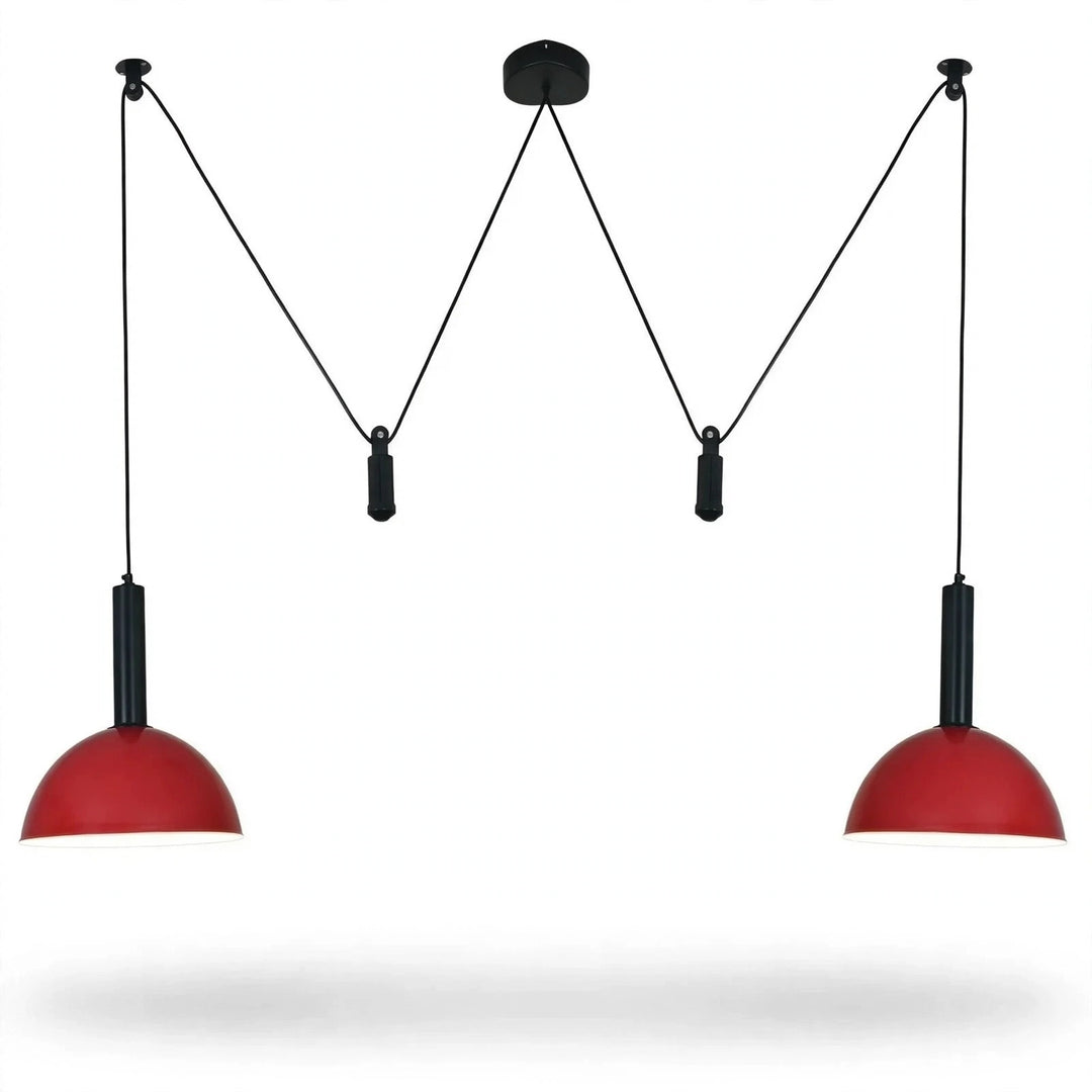 A modern two-light pendant ceiling fixture with red dome-shaped shades and black suspension rods, shown against a plain white background.