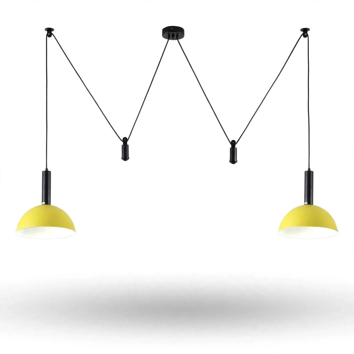 A modern two-light pendant ceiling fixture with black cords and canopies and bright yellow dome-shaped shades, shown against a plain white background.