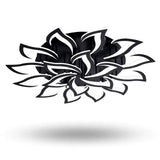 A black and white ceiling light has layered, outward-curving petals around a round black base against a plain white background.