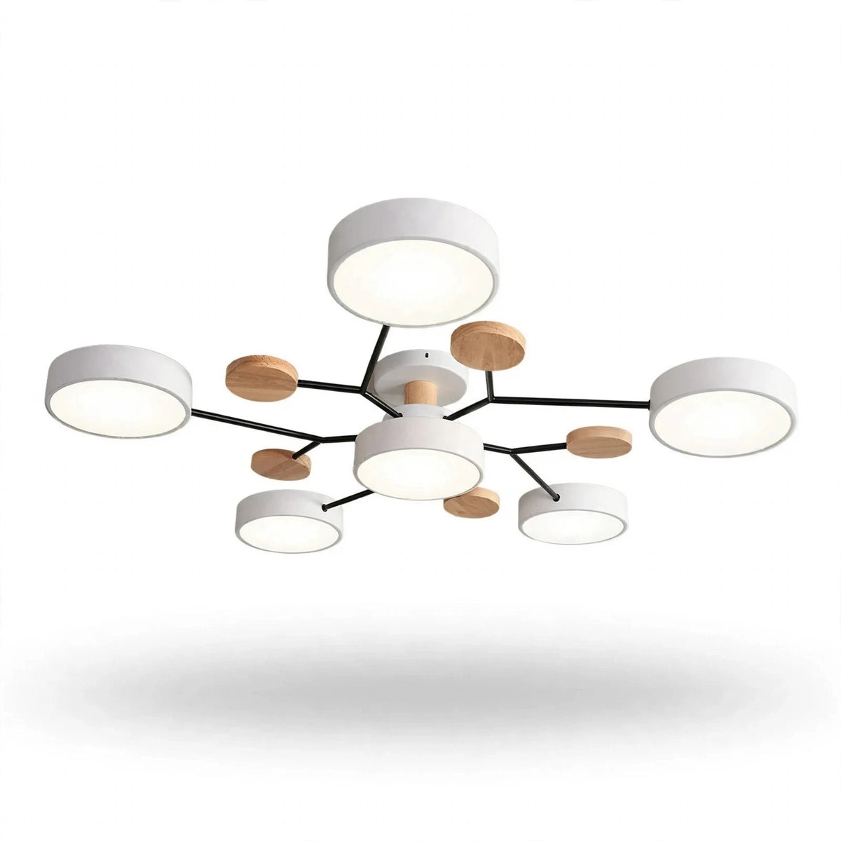 Modern multi-light ceiling fixture with white cylindrical shades, black metal arms, and small round natural wood accents, shown against a plain white background.