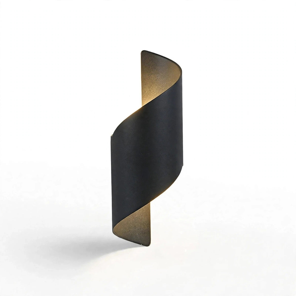 A modern spiral-shaped wall sconce with a matte black outer finish and a warm gold-toned inner lining, shown against a clean white background.