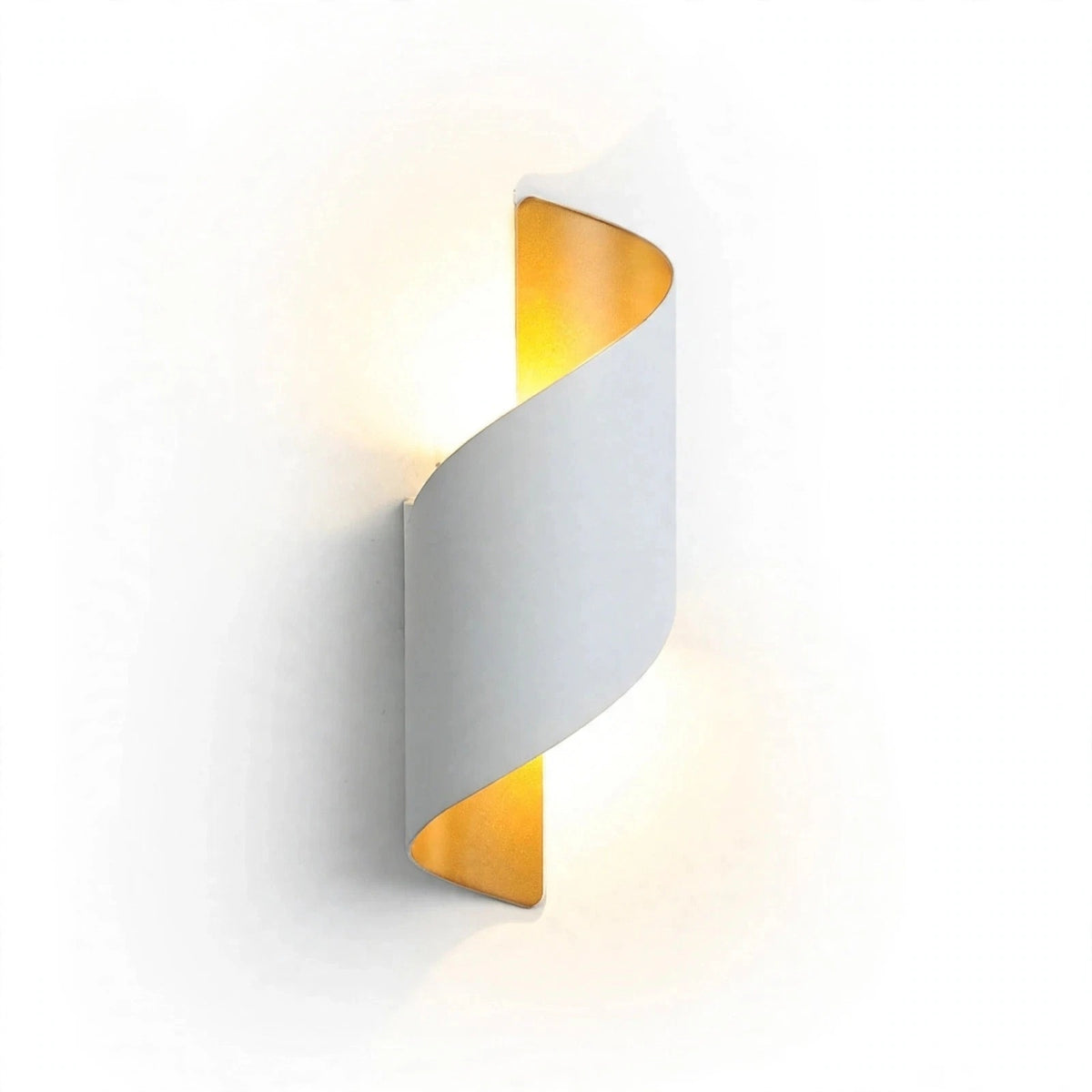 A modern spiral-shaped wall sconce with a matte white outer body and a warm gold inner lining, emitting a soft yellow light against a clean white background.