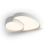 Silver-toned ceiling light with two overlapping rounded acrylic panels glowing warmly against a white background.