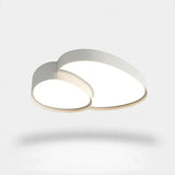 A modern cloud-shaped ceiling light fixture with a white outer frame and a warm beige inner trim, shown illuminated against a clean white background.
