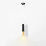 A modern cylindrical pendant light with a matte black upper body and a brushed gold lower shade, suspended by a thin black cord against a clean white background.