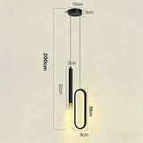 A black modern pendant light with a long cylindrical shade and a large rounded rectangular shade, shown with dimension labels on a plain beige background. The image includes measurements for total height, lamp width, and individual shade dimensions.