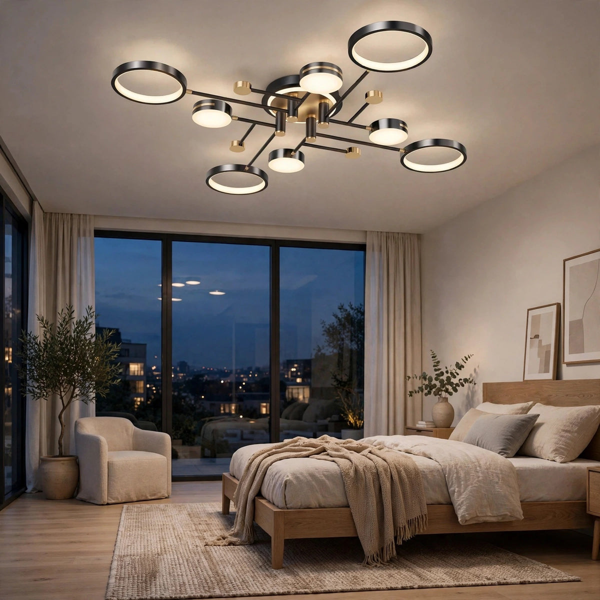 Modern multi-light ceiling fixture with circular LED rings and a brushed metal frame, installed in a contemporary bedroom with large windows overlooking a city skyline at dusk.