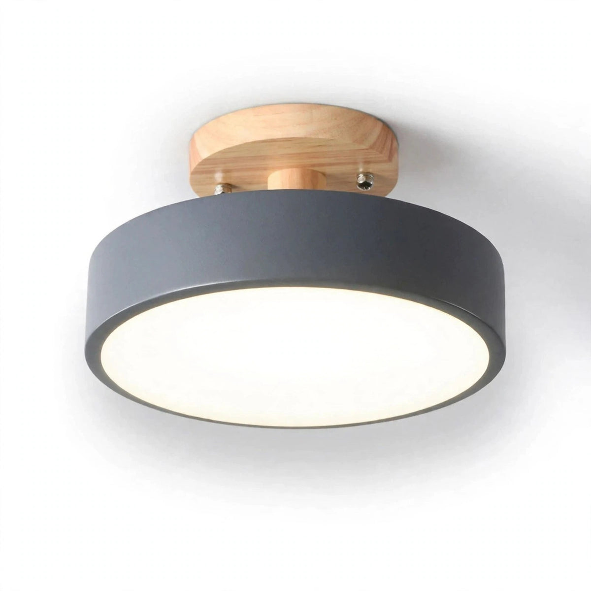 A modern semi-flush mount ceiling light fixture featuring a matte dark gray cylindrical shade, a natural light wood ceiling mount, and a glowing white diffuser, shown against a plain white background.