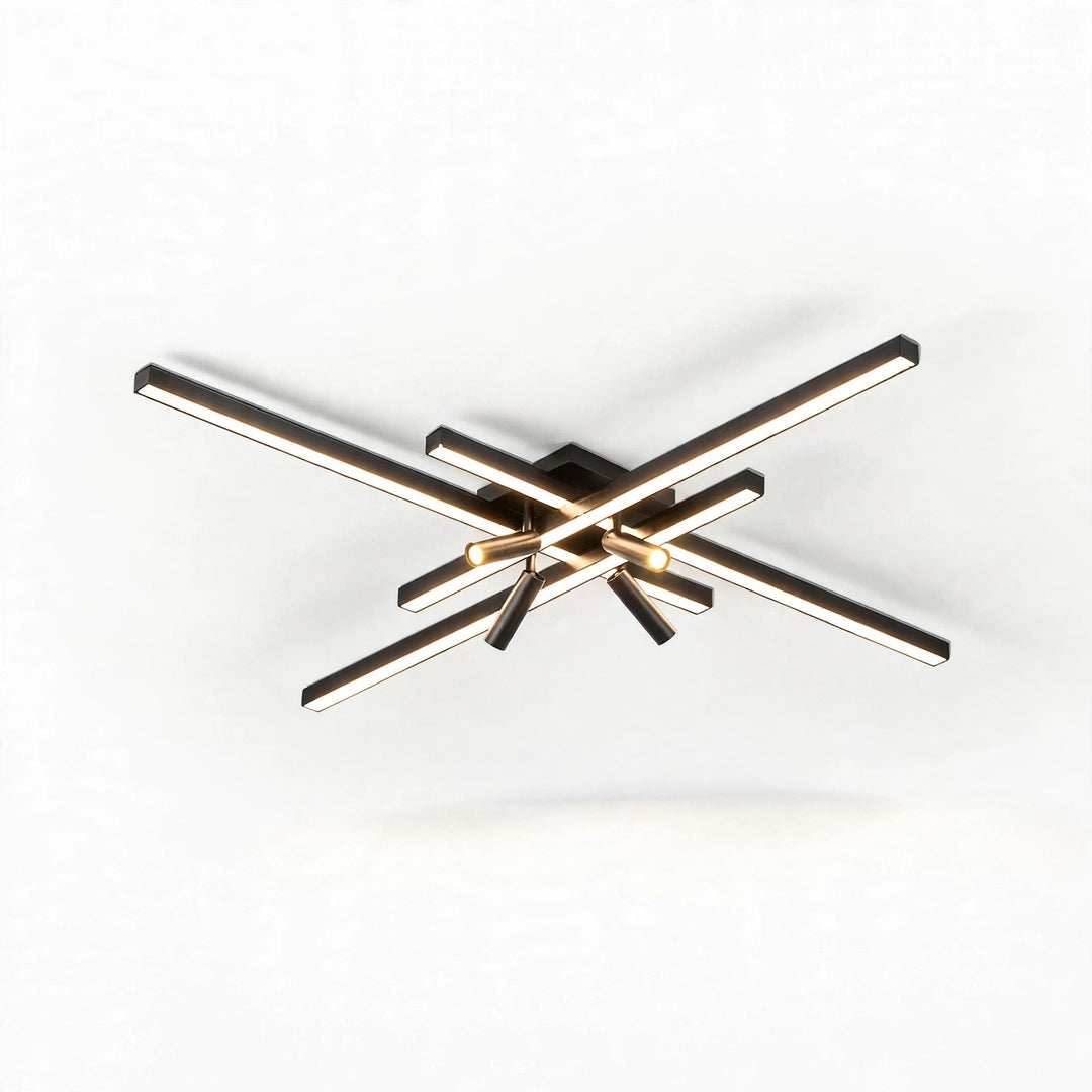 Black crossed linear-bar ceiling light with glowing light bars and dark cylindrical spotlights against a plain white background.