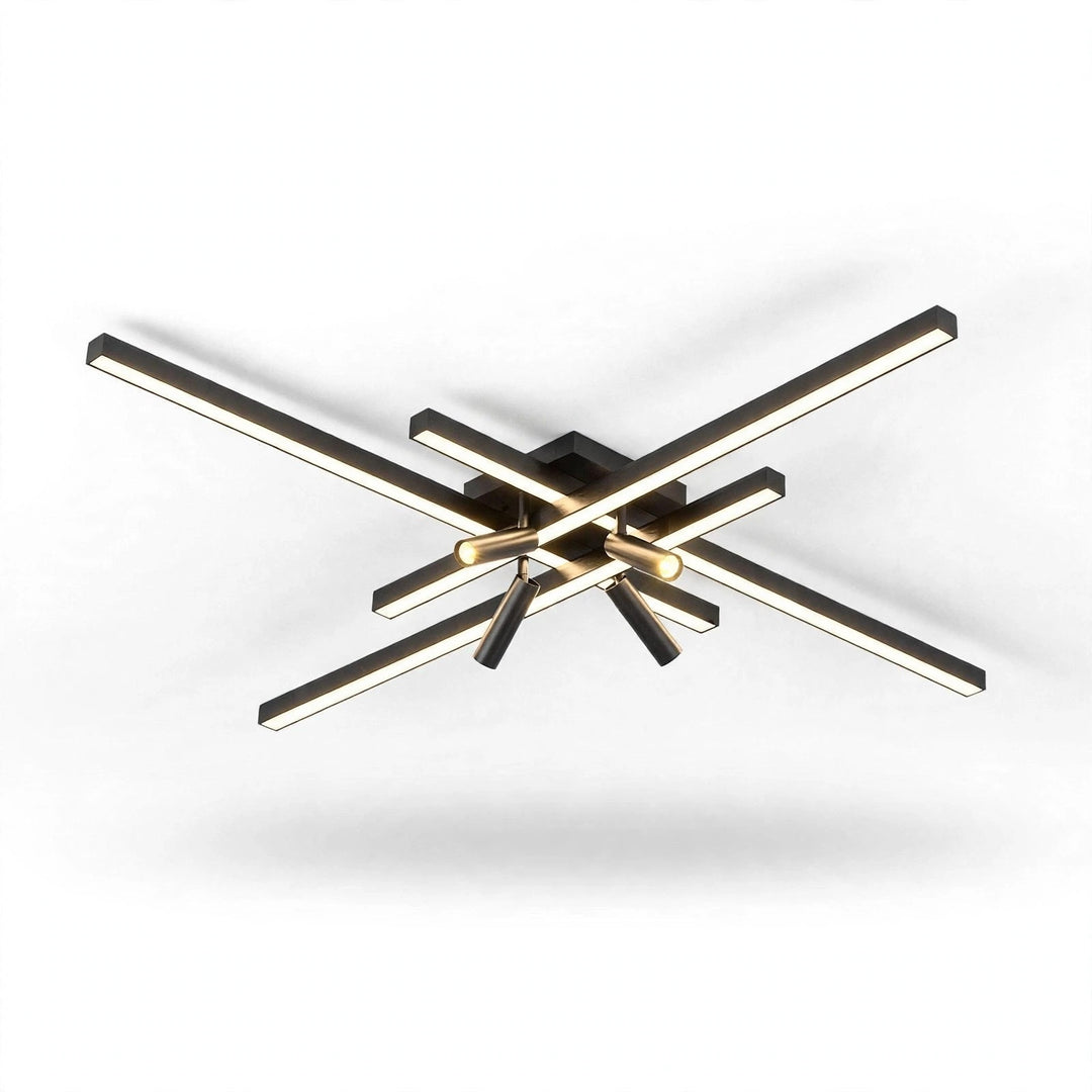 Black crossed linear-bar ceiling light with warm glowing bars and spotlights, seen from slightly below on a white background.
