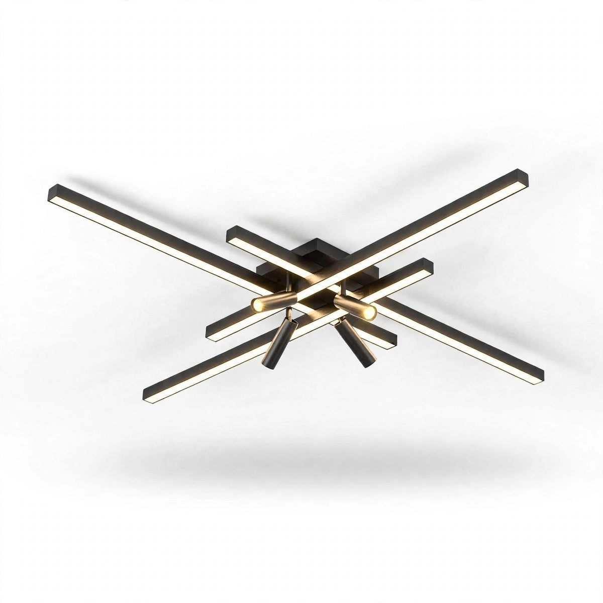Black crossed linear-bar ceiling light with warm glowing bars and spotlights, seen from slightly below on a white background.