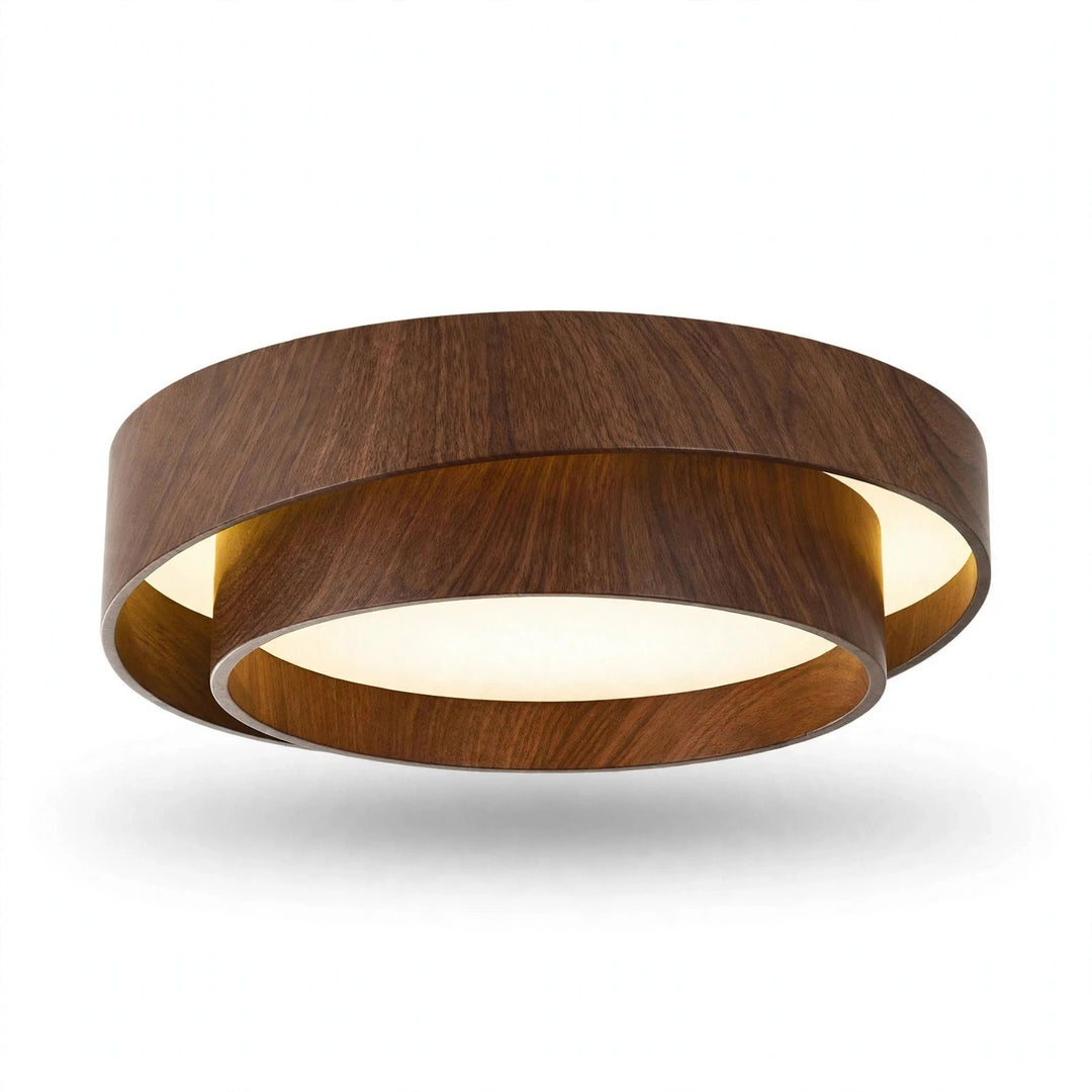 A modern circular flush-mount ceiling light fixture with a dark brown wood-grain outer ring and a warm white illuminated inner ring, shown against a plain white background.