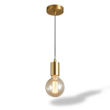 A modern industrial-style pendant light with a brushed gold ceiling canopy, a black cord, and a gold-finished socket holding a clear glass globe bulb with an illuminated filament, shown against a white background with a soft shadow.