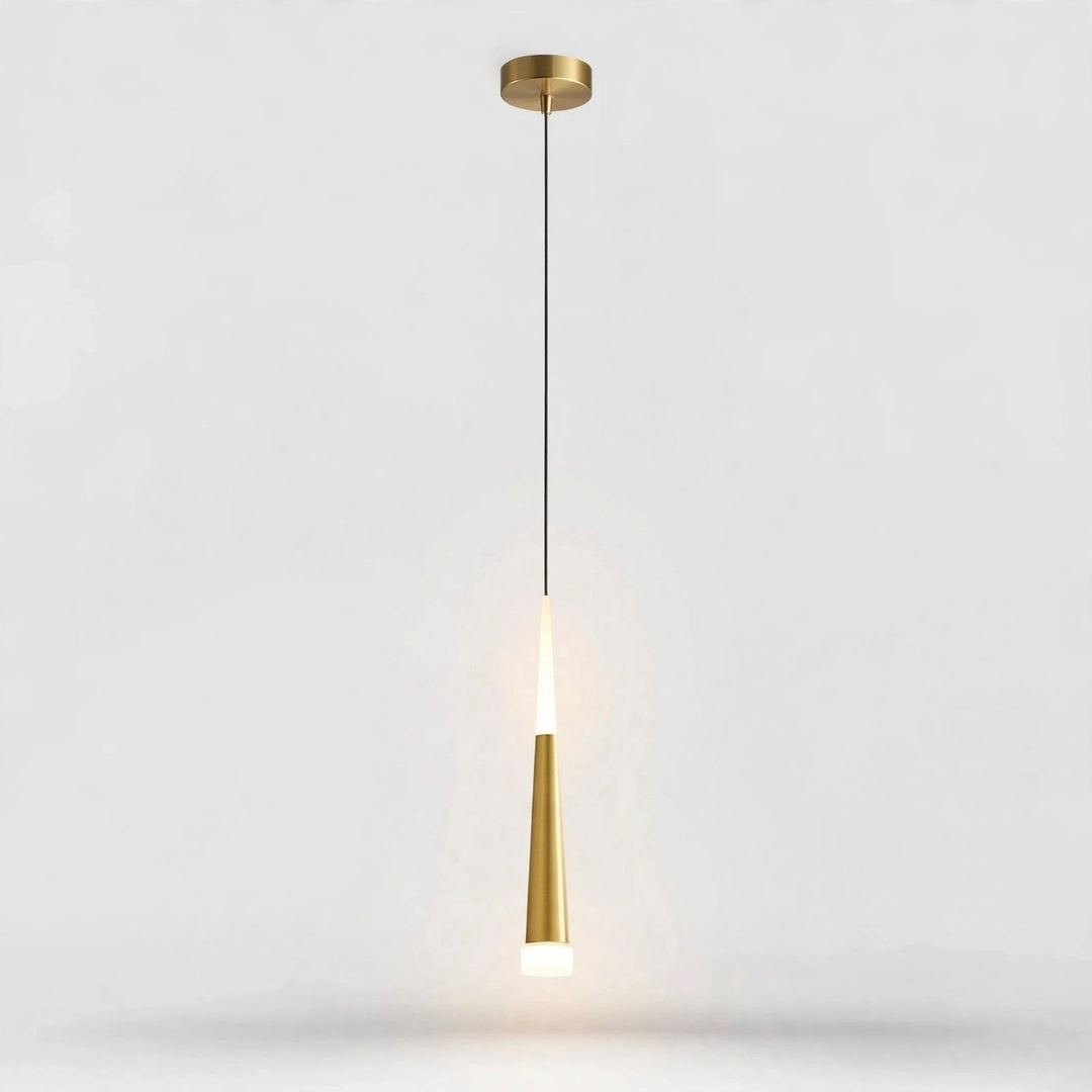 A modern pendant light fixture with a brushed gold ceiling canopy and a tapered gold shade, suspended by a thin black cord against a light gray background.