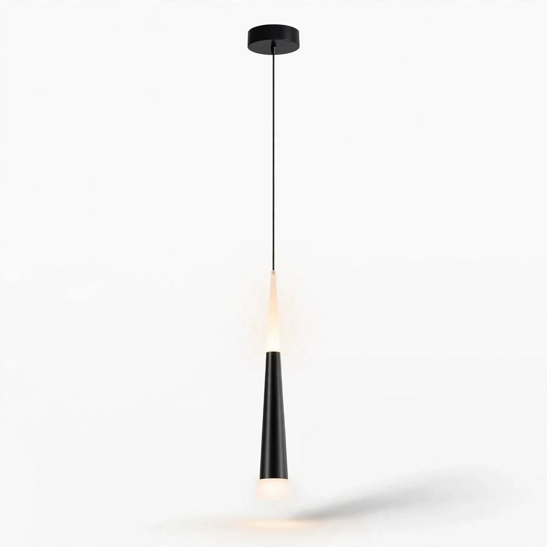 A modern black pendant light with a sleek tapered shade and a warm glowing bulb, suspended by a thin cord from a circular ceiling canopy against a plain white background.