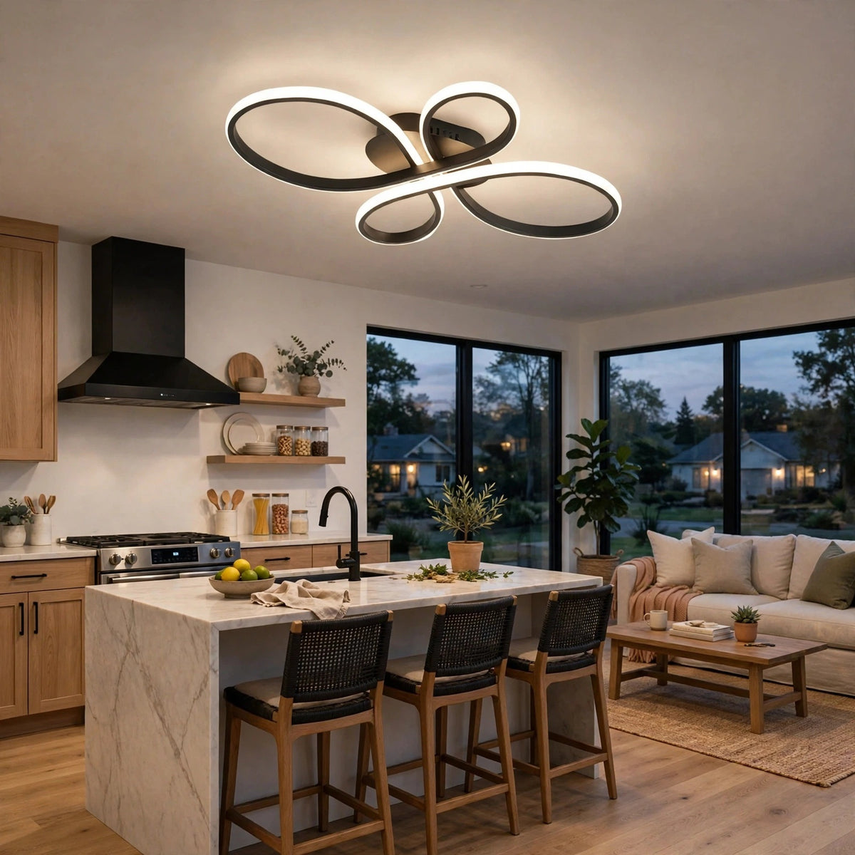 Modern multi-ring LED ceiling light fixture with black metal rings and white illuminated LED edges, installed in a contemporary kitchen and living room setting.