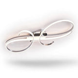 A silver ceiling light with reflective curled loops and white illuminated strips is shown against a white background with a soft shadow.