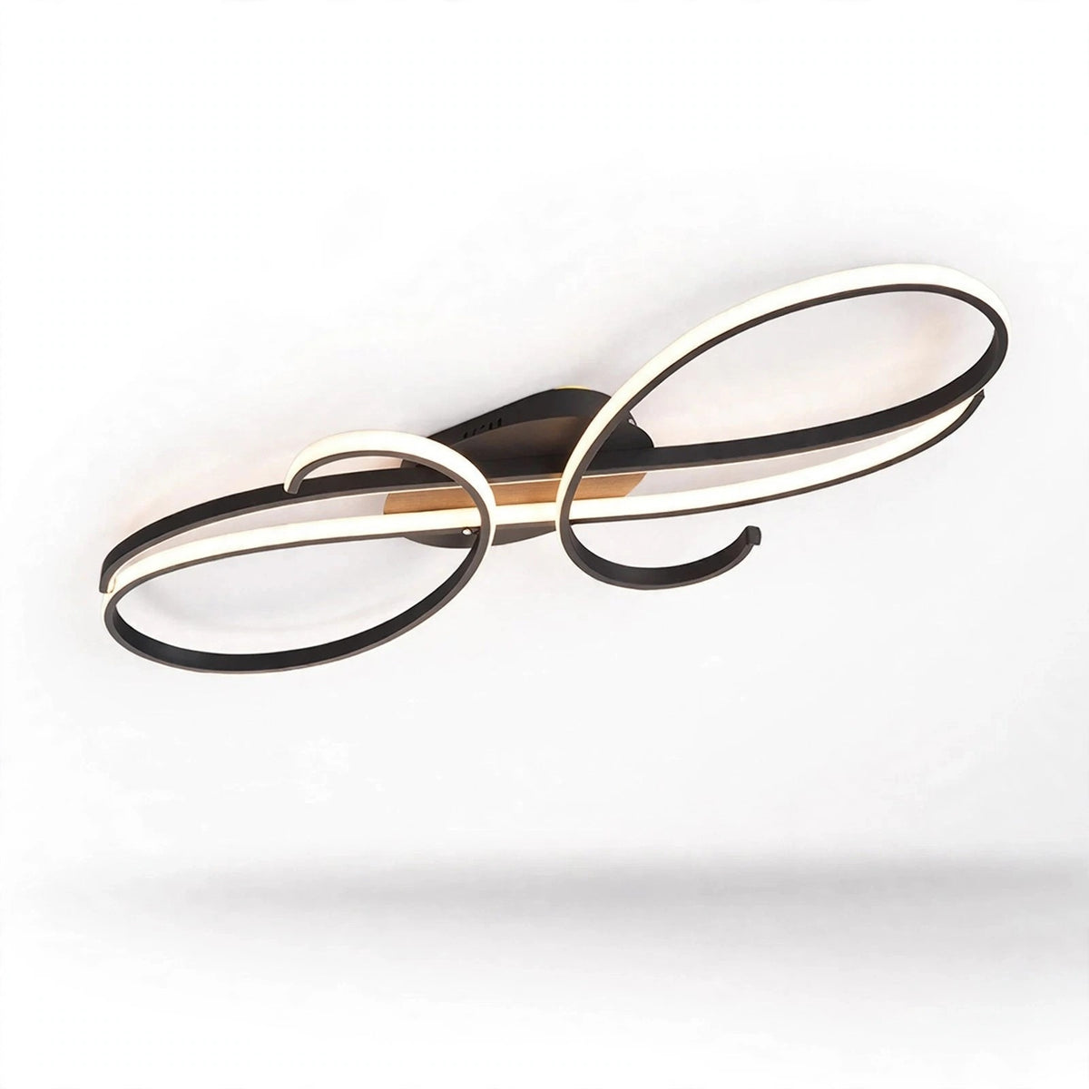 A black ceiling light with opposing curled loops and white illuminated strips is shown at an angle against a white background.